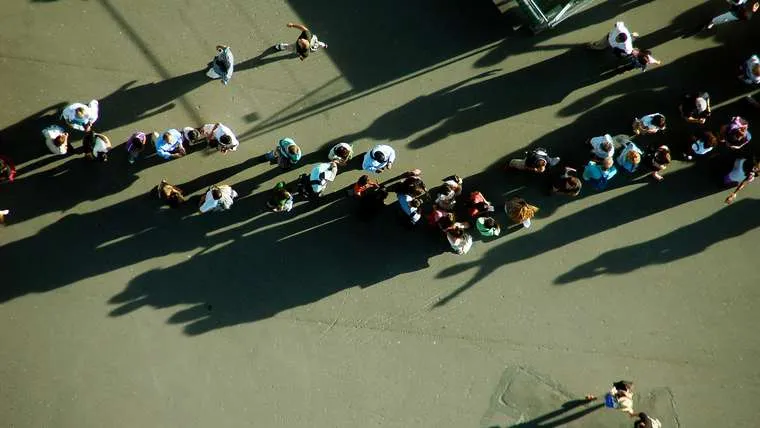 A long queue of people, seen from high above