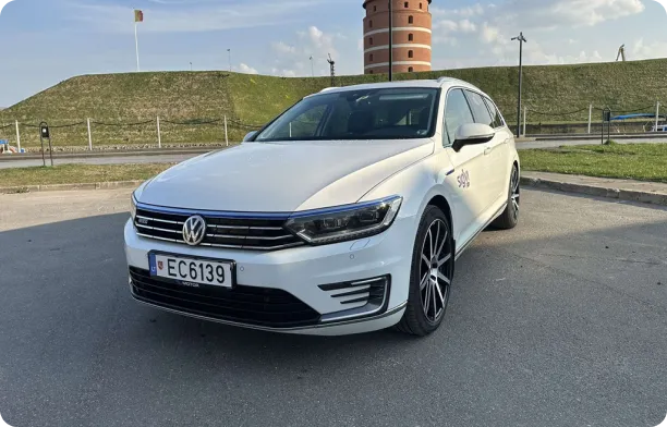 A white VW Passat in a car park