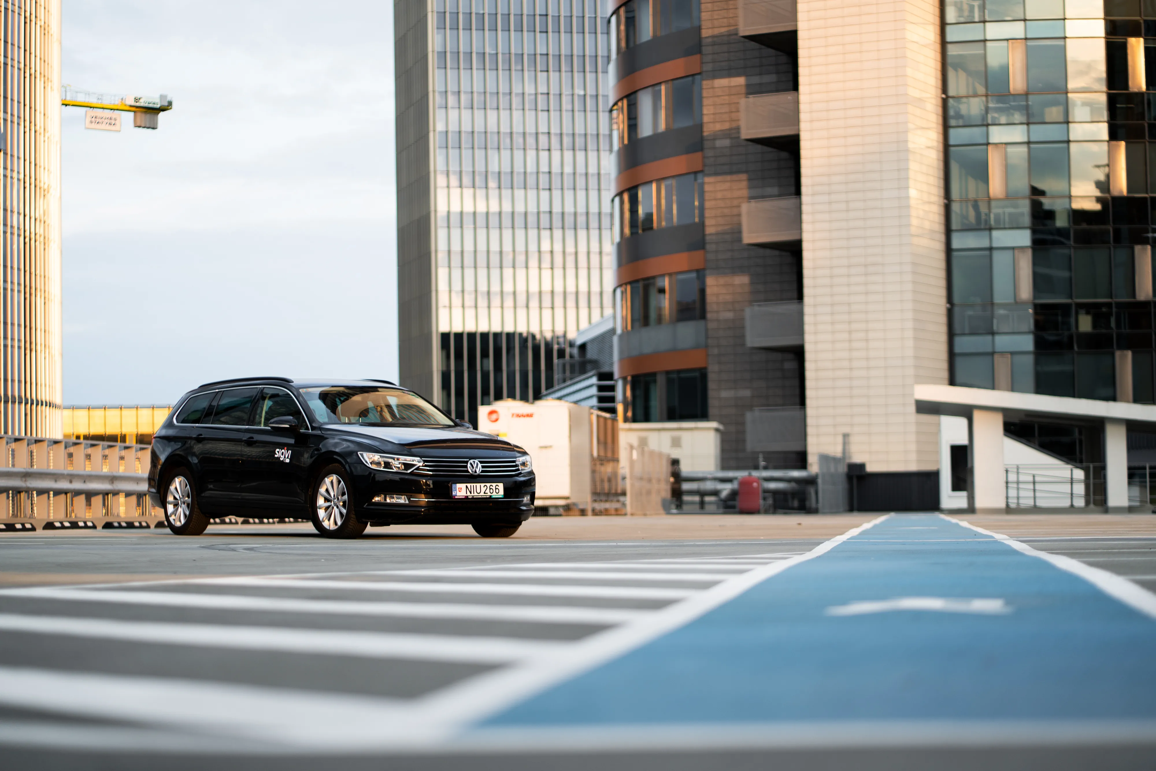 A black Sigvi car on a city street